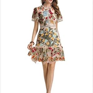 There is no brand name on this dress but it’s exquisite and only worn once.